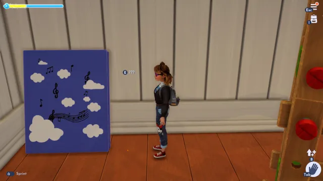 The player looking at a pebble by a book in the Toy Story Realm. 