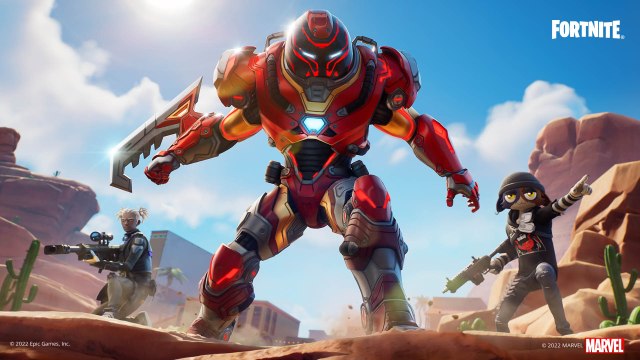 Iron Man Zero stands in the center atop a canyon with two other Fortnite characters on his left and right individually.