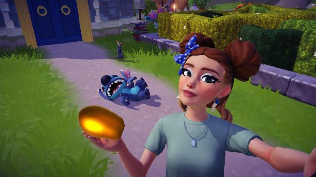 The player taking a selfie with the Golden Potato with Stitch in the background. 