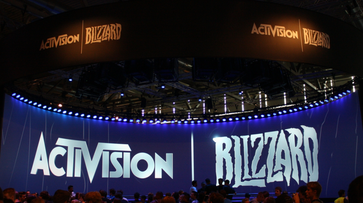 two large, blue stage curtains with activision blizzard written across them
