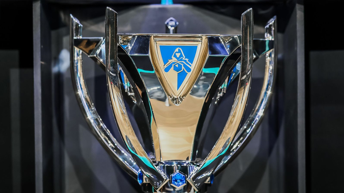 A silver trophy, with the gold and blue logo of the Summoners Cup at the top of the trophy.