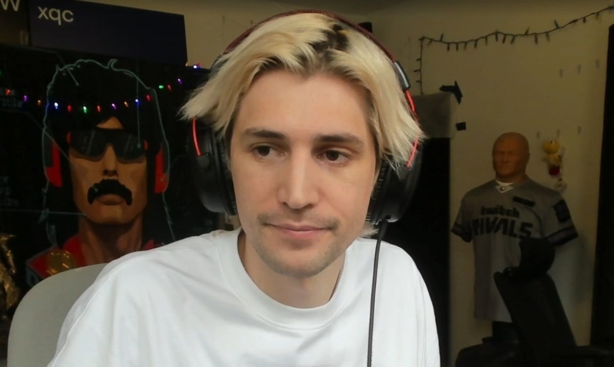 xQc sitting in front of the camera.