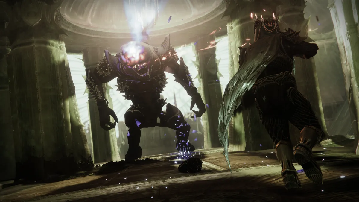 A Guardian wearing Taken King armor fighting a Hive Ogre inside a Lucent Hive ship.
