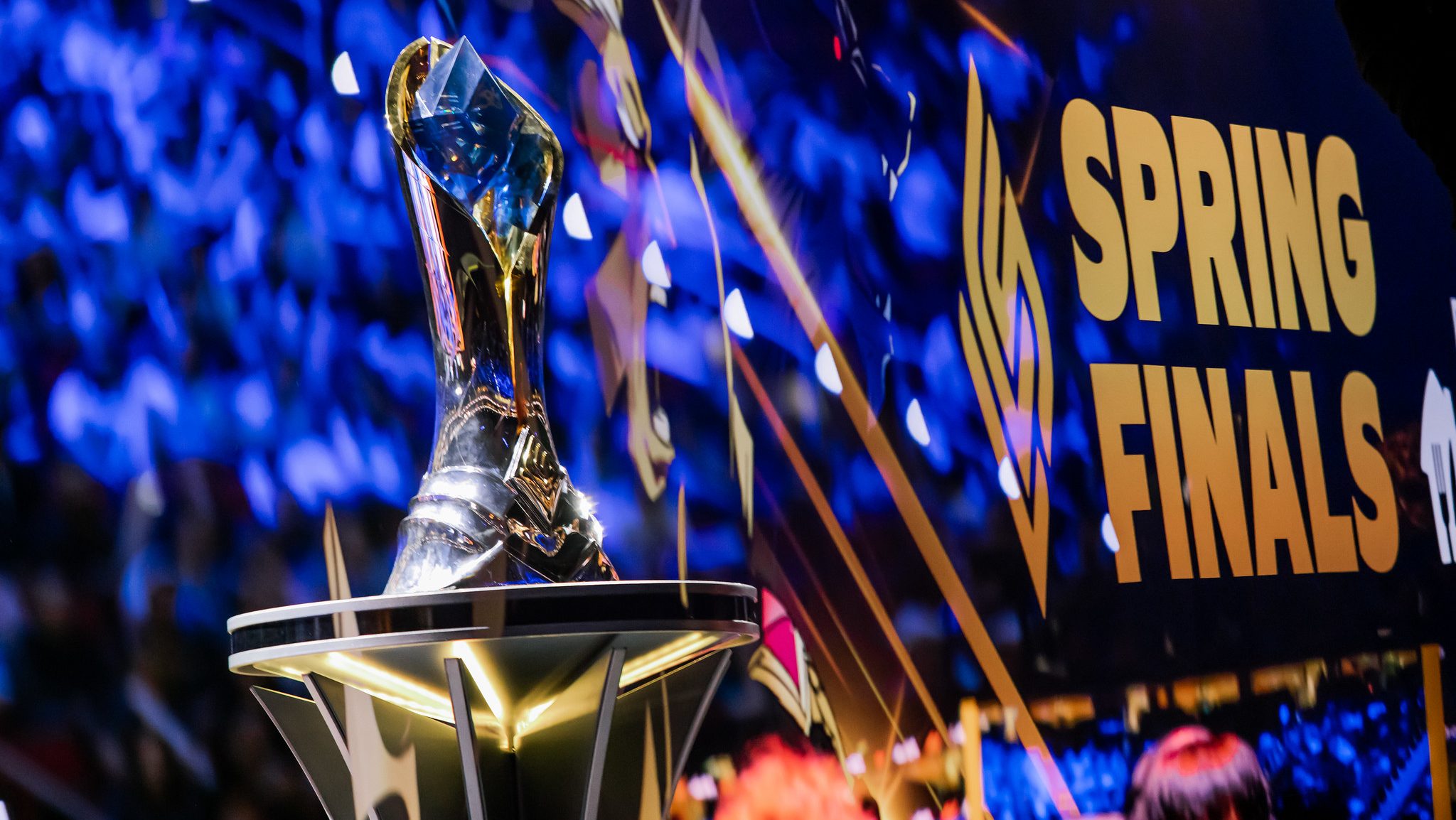 The LCS trophy in front of a Spring Finals banner.