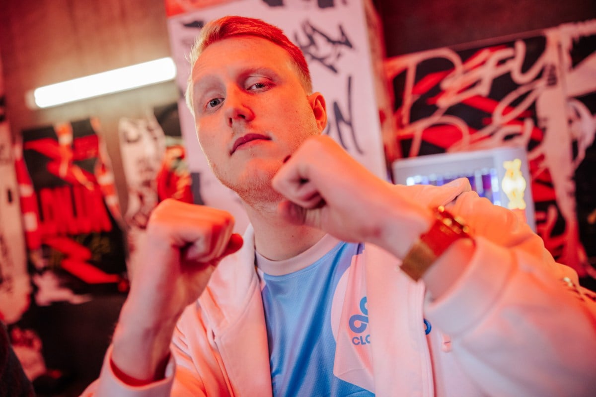 Zven showing his fists to the camera like he's ready to fight.