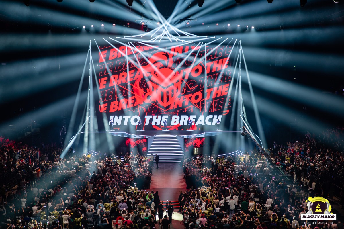 The banner of CS:GO organization Into the Breach displayed during the BLAST Paris Major. The logo is essentially a knight helmet painted in bright red.
