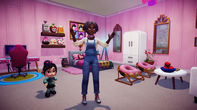The player standing next to Vanellope in a pink candy-themed room.