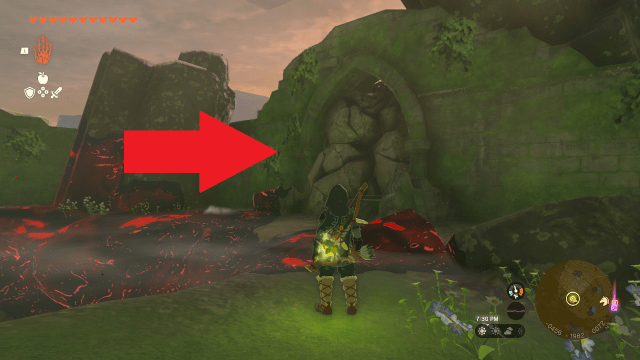 Link stands in front of rubble and a red arrow points to a wall of destructible rocks.
