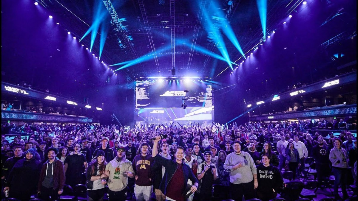A crowd of fans cheers at a CoD Challengers event.