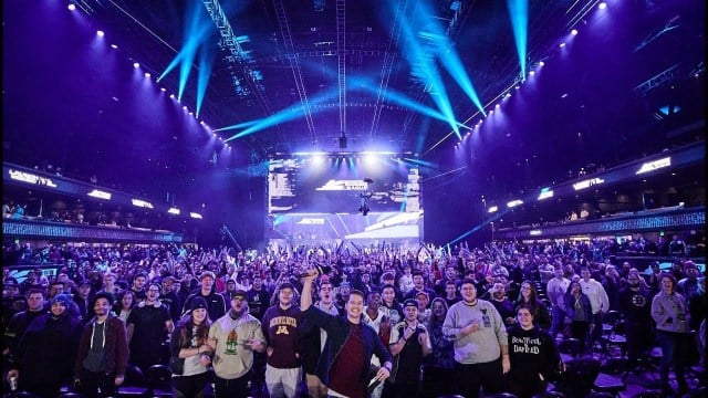 A crowd of fans cheers at a CoD Challengers event.