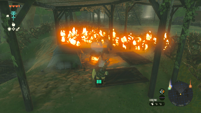 Link stands beneath a wooden awning. In front of him, a briar patch has been lit on fire.