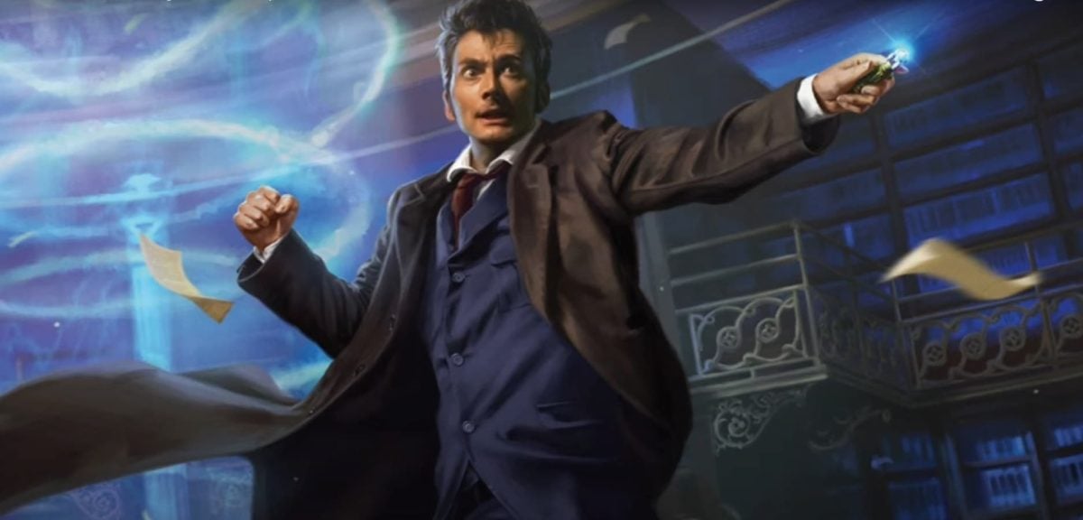 David Tennant as Doctor Who, standing outside the Tardis while using his sonic screwdriver.