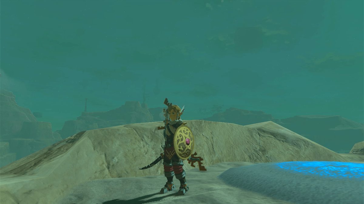 Link standing in front of a shrine wielding the Gerudo Scimitar and Shield.