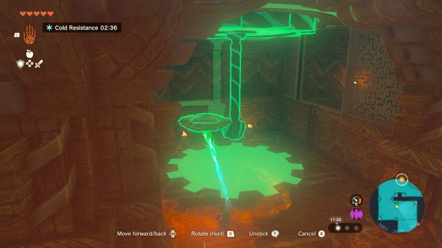 Link turns the cog mechanism using Ultrahand and a piece of broken masonry.