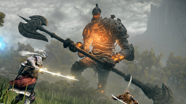 A player in Elden Ring stands beneath a monstrous enemy.