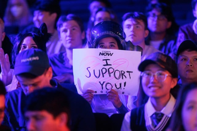 LCS fan holds "I Support You" sign in the crowd at Riot Games Arena.