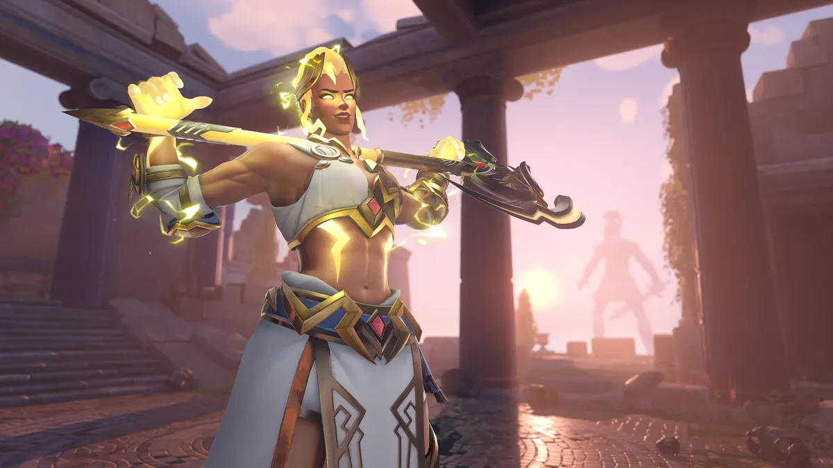 Junker Queen holds her axe across her shoulders while in her Zeus skin on the Ilios map of Overwatch 2.