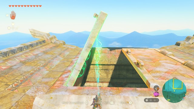 Link uses Ultrahand to open one of the doors at the top of the Wind Temple.