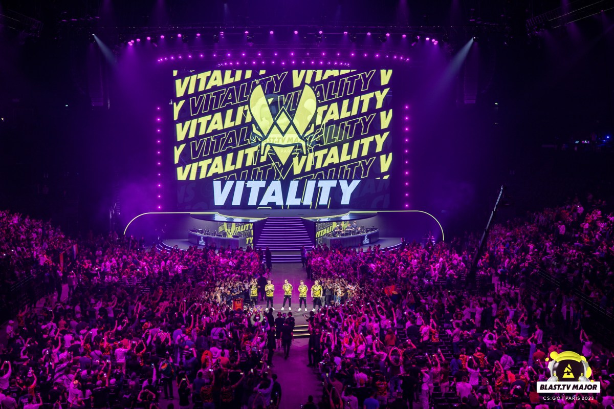 Vitality's logo on a screen with the crowd surrounding it.
