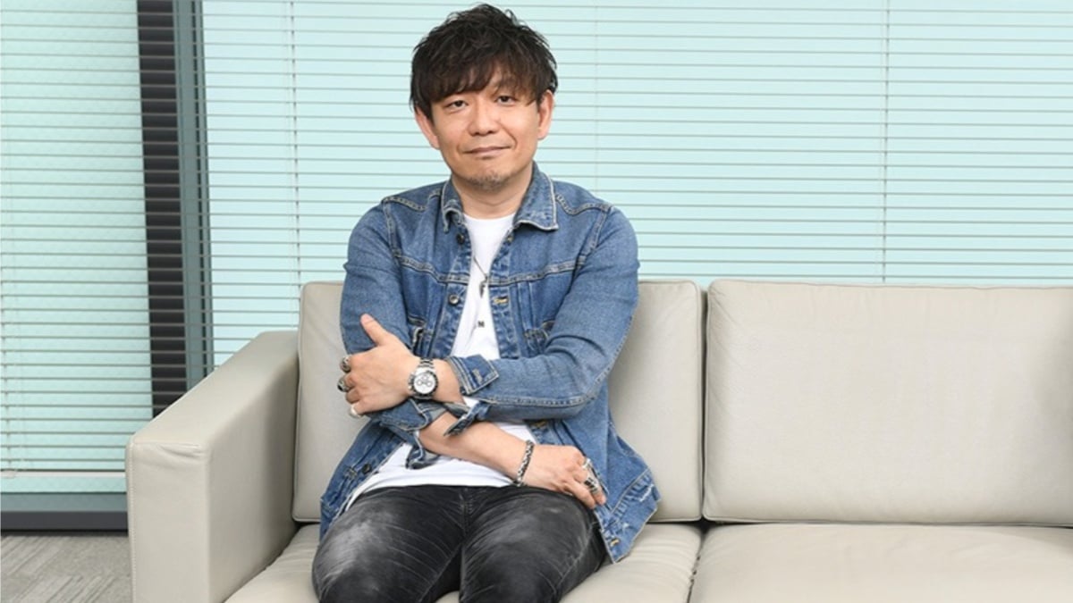 naoki yoshida sitting on a sofa