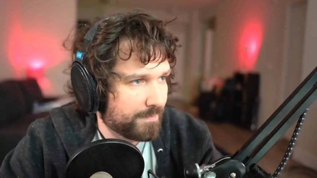 Destiny speaking into his PC microphone while streaming.