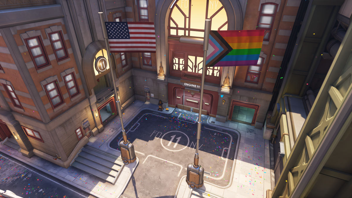 The first point on the hybrid map Midtown is filled with rainbow colored confetti and features a Pride flag directly next to a United States flag at the first capture point.