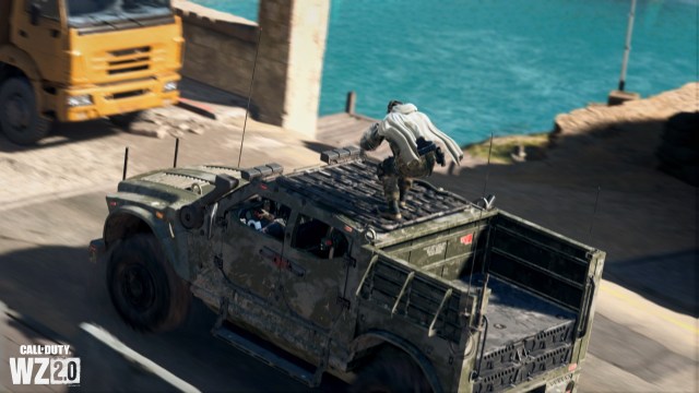 A player controlling an SUV in a match of DMZ