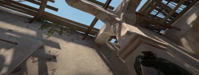 A CS:GO player looking into a gap at upper B tunnels on Dust 2.