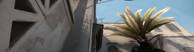 A player prepares to throw a smoke on long A on Dust 2 in CS:GO.