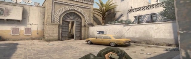 A CS:GO player lines up a smoke outside long A-bedroom on Dust 2.