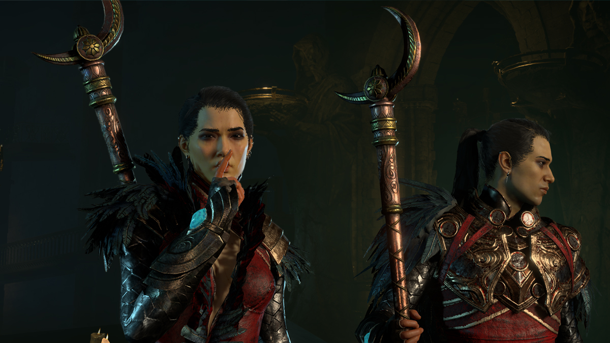 Two Sorcerers in full armor stand with their crescent moon staffs in Diablo 4, with the Sorcerer on the left holding their finger to their mouth.