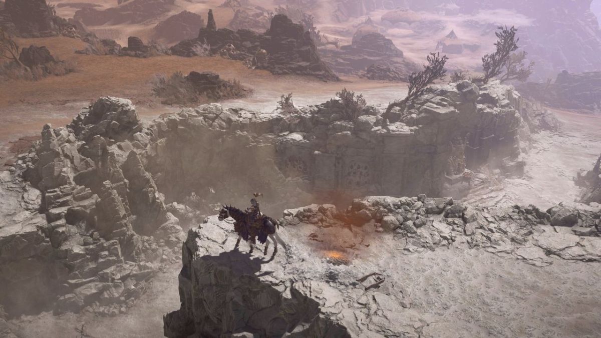 Horse and person on dry cliff in the Dry Steppes of Diablo 4.