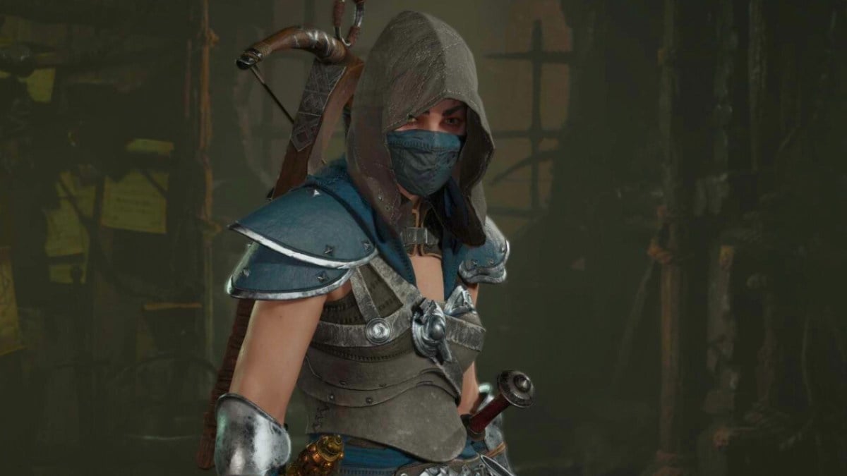 A woman of the Rogue class in Diablo 4 wearing a blue hood and wielding a cross bow.