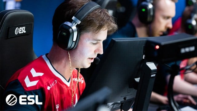 Astralis AWPer device sits at his PC during the IEM Dallas 2023 group stage.
