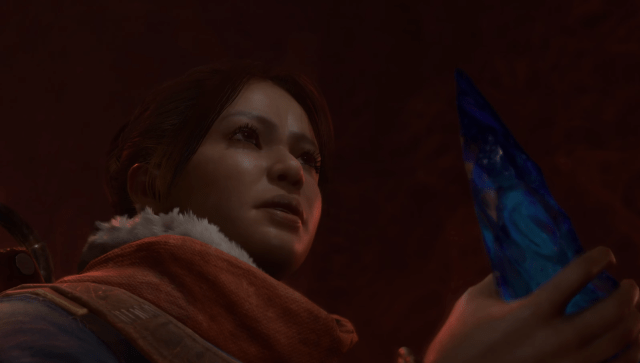 A Diablo 4 character holding some kind of blue object.