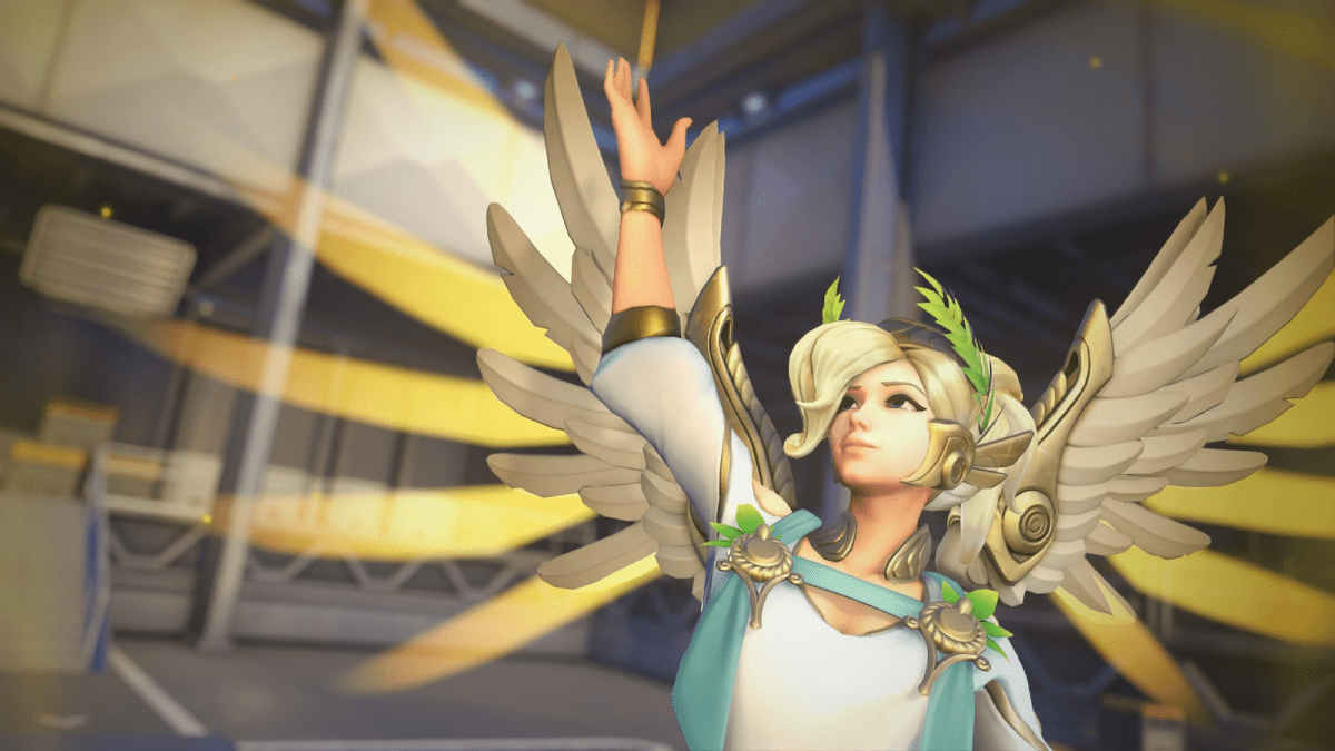 Mercy emoting in Overwatch 2 with gold winged skin