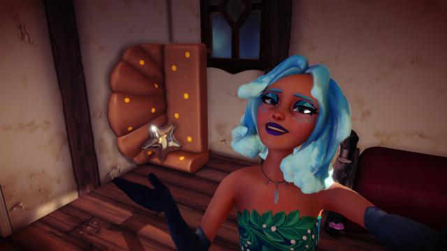 The player taking a selfie with an ocean-themed couch that is actually Mother Gothel's mirror. 