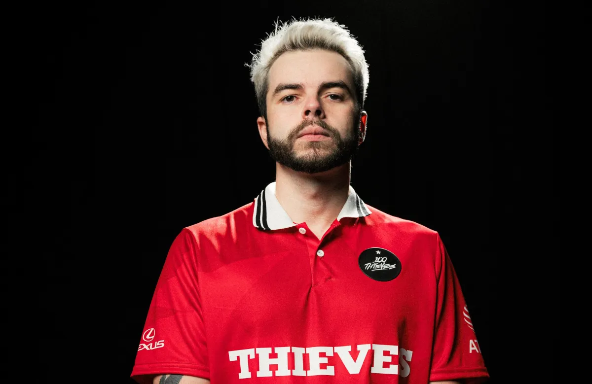 Nadeshot posing with the 2023 100 Thieves official jersey