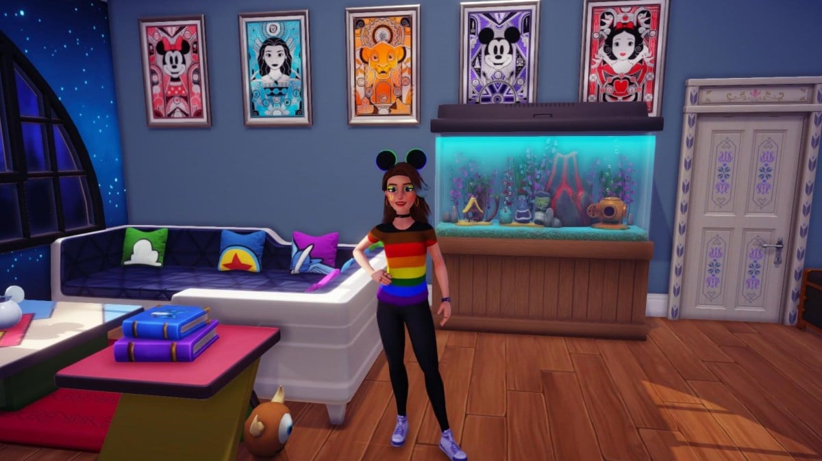 The player standing in their house wearing a Pride shirt.
