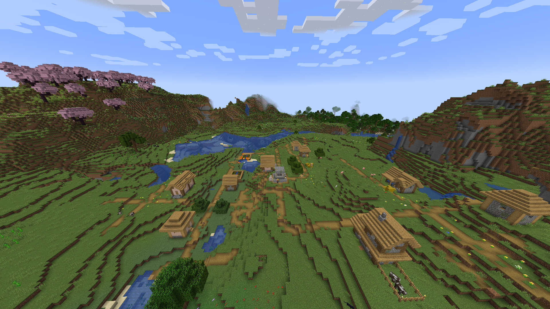 Vesnice sedící obklopená kopci v Minecraftu