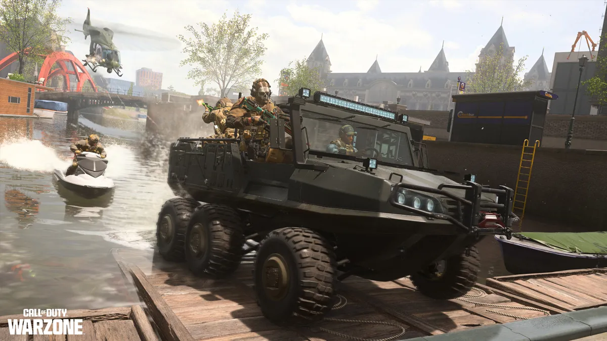 A squad drives a vehicle out of a canal with a second team behind them in a jet ski on Vondel, the new DMZ map.