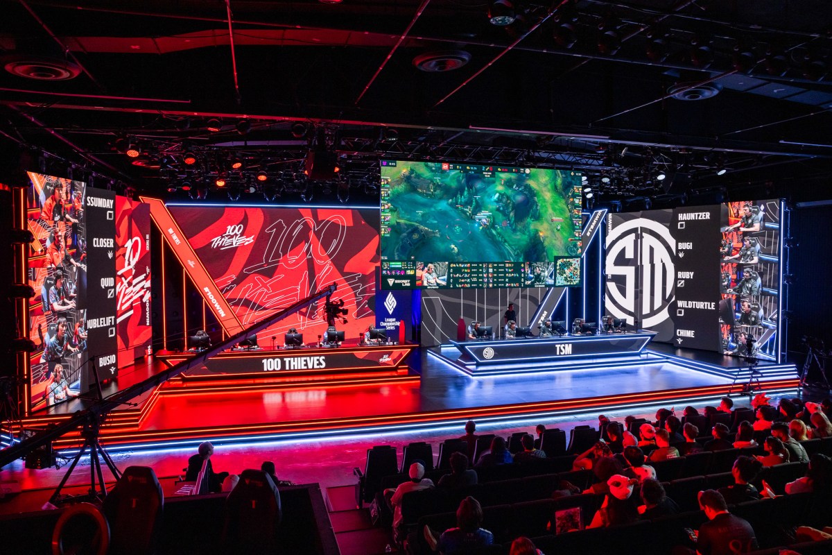 The LCS stage lit in the colors of black and red for an in-progress matchup between 100 Thieves and TSM during the 2023 Summer Split.
