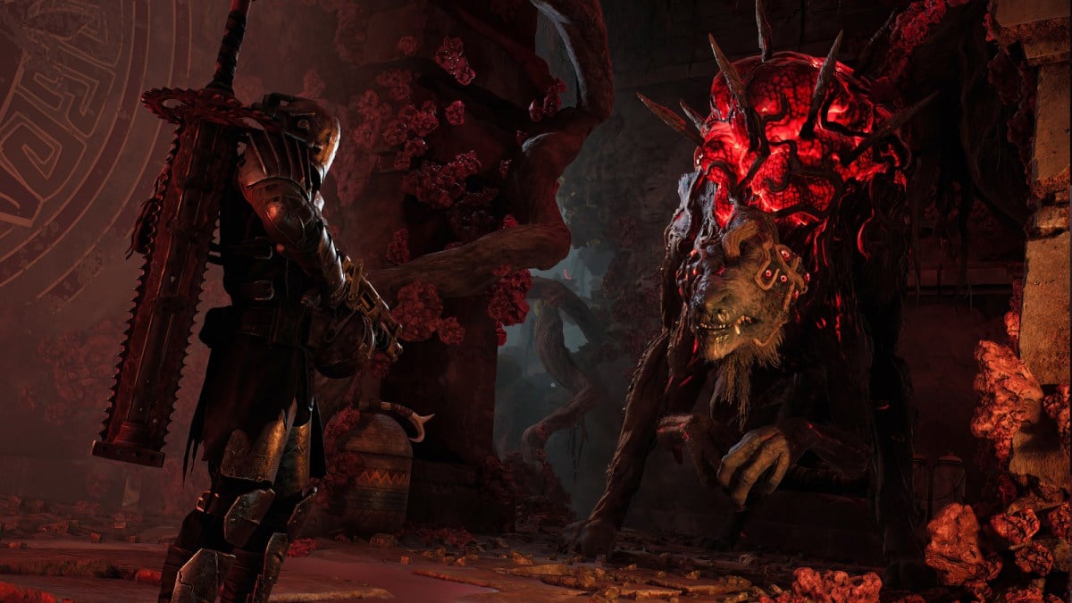 A player in Remnant 2 stands opposite a giant beast with a huge glowing red bulge on its back.