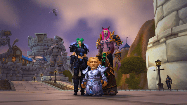 Human, Night Elf, and Gnome standing at the Stormwind Gates