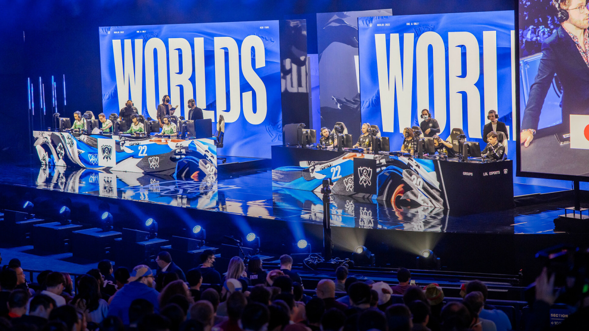 Two League of Legends teams compete on-stage at the 2022 LoL World Championship