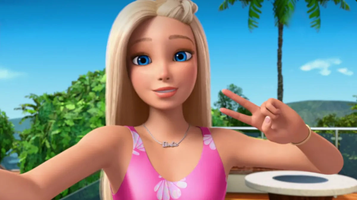 Barbie takes a selfie posing with a piece sign.