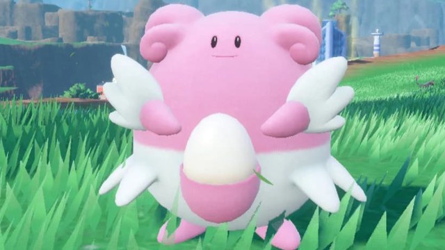 Blissey standing in a field holding its belly.
