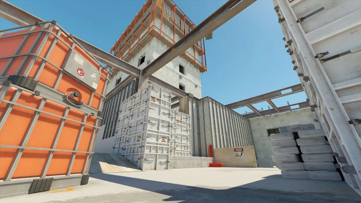 A construction site takes shape on top of a highrise building with beams and concrete bags on Vertigo in Counter-Strike.