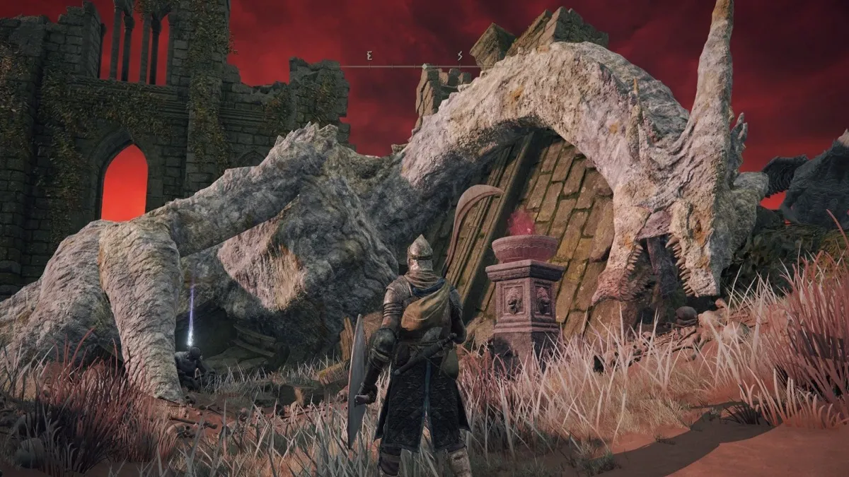 The Church of Dragon Communion with a dragon corpse in Elden Ring