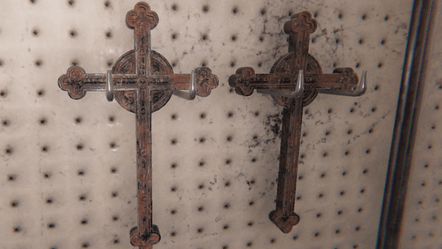 Two Crucifixes hanging on a wall. 